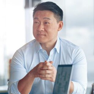 Young Asian businessman listening his colleagues on meeting in modern office worker talking to the man